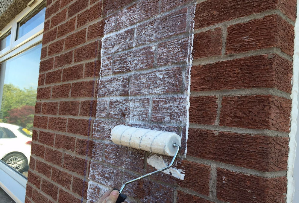 Applying Masonry Creme to masonry wall